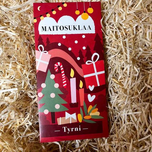 maitosuklaa tyrni joulusuklaa on kauniissa jouluisessa, punaisessa pakkauksessa